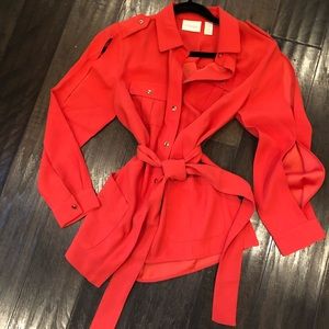 Safari-style bright orange shirt